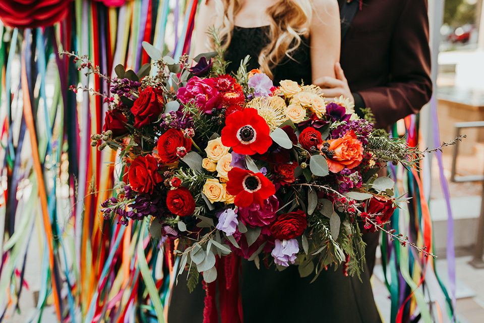 dia-de-los-muertos-shoot-closeup-on-florals-big-colorful-florals-in-moody-colors-like-deep-reds-oranges-and-purples