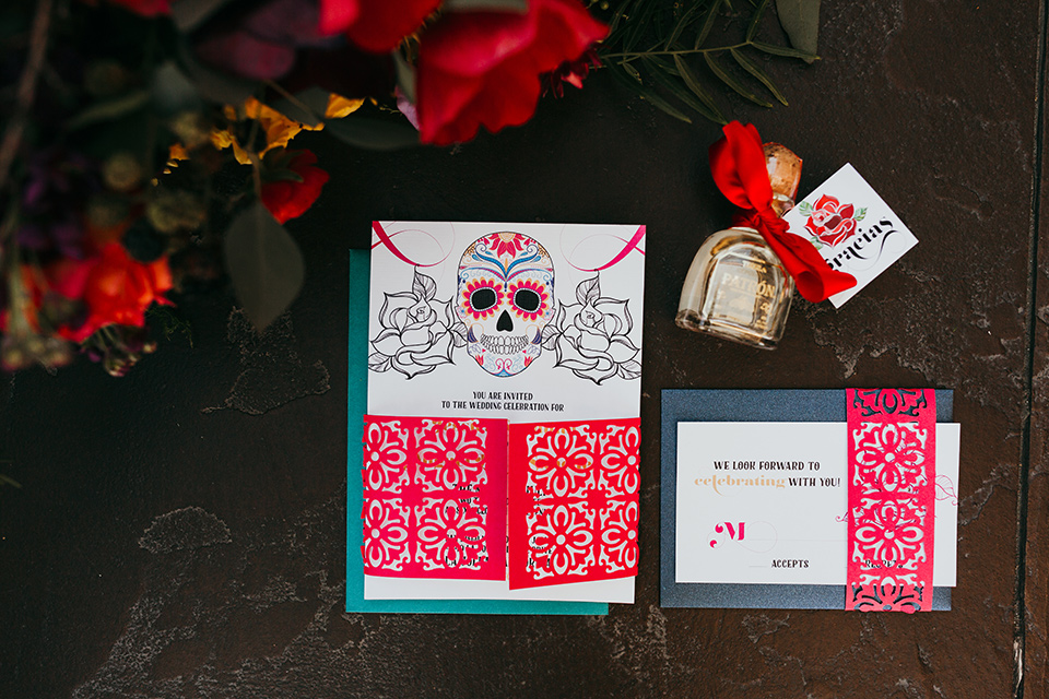 dia-de-los-muertos-shoot-invitaions-white-invites-with-bright-colorful-writing-and-text-and-sugar-skull-deatils