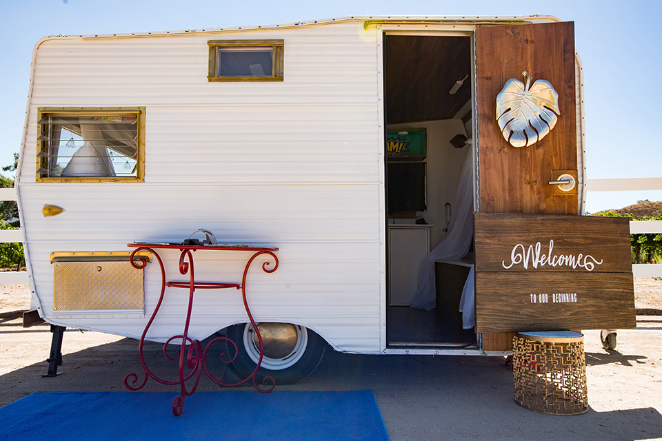 wonder-woman-meets-superman-camper-white-camer-with-wooden-accents-and-a-blue-rug