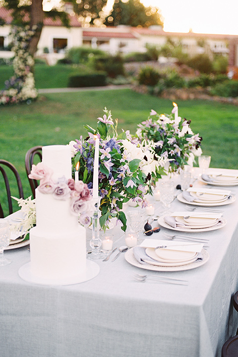 Inn-at-rancho-santa-fe-shoot-table-set-up-to-the-side-white-table-linens-with-gold-chairs-and-metallic-acents