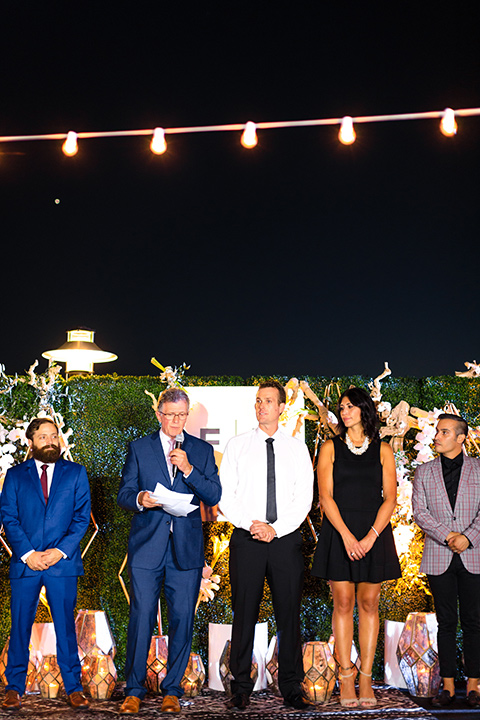 evolution-of-style-party-company-employees-with-greg-giving-speech-employees-wearing-many-styles-of-suits-while-talking-about-the-new-friar-tux-brand-at-the-fifth-restaurant