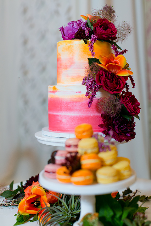 Exquisite-weddings-magazine-colorful-cake-three-tier-cake-with-bright-colored-fondant-and-florals-cascading-down