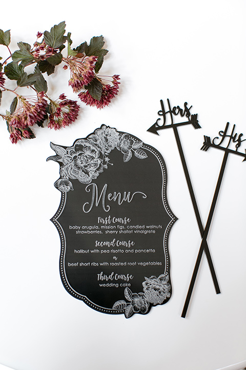 Exquisite-weddings-magazine-menus-black-menu-cards-with-white-calligraphy-and-his-and-hers-drink-stir-sticks