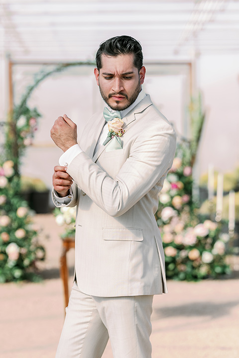  a garden romance wedding inspo with the bride in a luxe lace gown and the groom in a tan suit - groom 