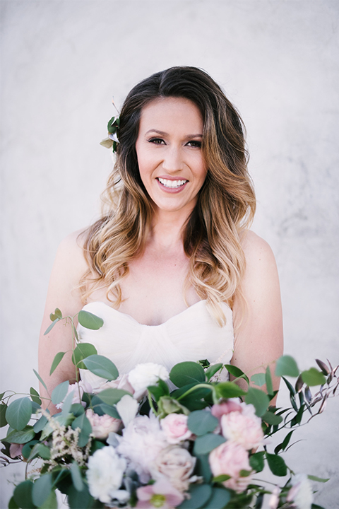 Orange county outdoor wedding at old ranch country club bride strapless ballgown with a sweetheart neckline and beaded detail holding light pink and green floral bridal bouquet 