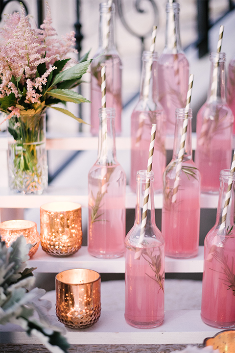 Orange county outdoor wedding shoot at old ranch country club assortment of pink drinks with white and gold striped straws in drinks with gold candle decor on white table stands and pink and green flower decor wedding photo idea for reception cocktail hour and drinks