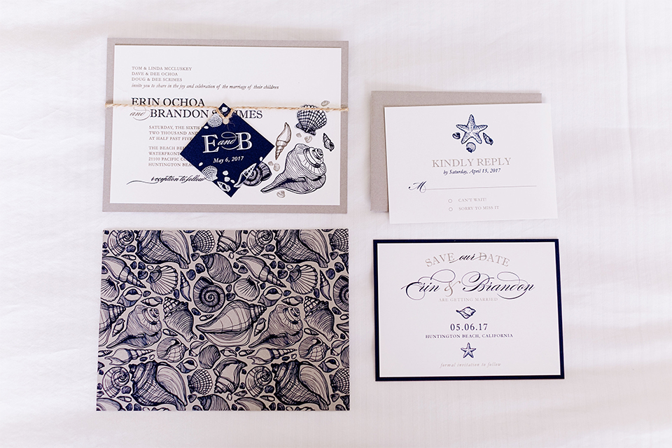 Huntington beach wedding at the hilton waterfront resort wedding invitations white with blue writing and patterned designs with white background and tan envelopes wedding photo idea for invitations