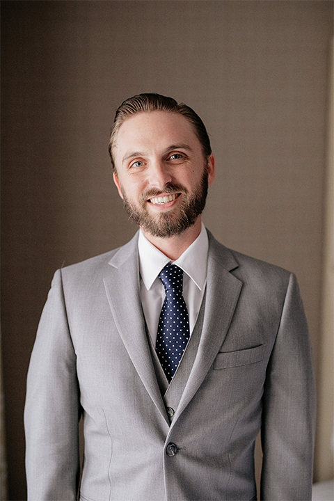 Huntington beach wedding at the hilton waterfront resort groom heather grey notch lapel suit with matching vest and white dress shirt with long navy patterned tie