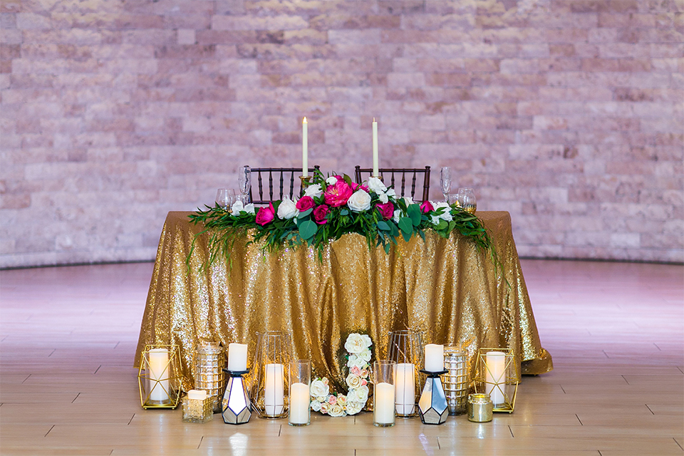 San juan capistrano outdoor wedding at the plaza de magdelena table set up black and white table linen with gold place settings and black linen napkins with white and black calligraphy menu with flower decor and glassware with white and pink flower centerpiece decor and black and white chiavari chairs