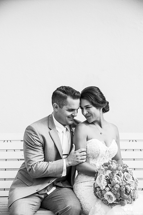 skybox-venue-wedding-bride-and-groom-black-and-white-photo-bride-in-strapless-gown-with-beaded-bodice-groom-in-light-grey-suit-with-ivory-tie