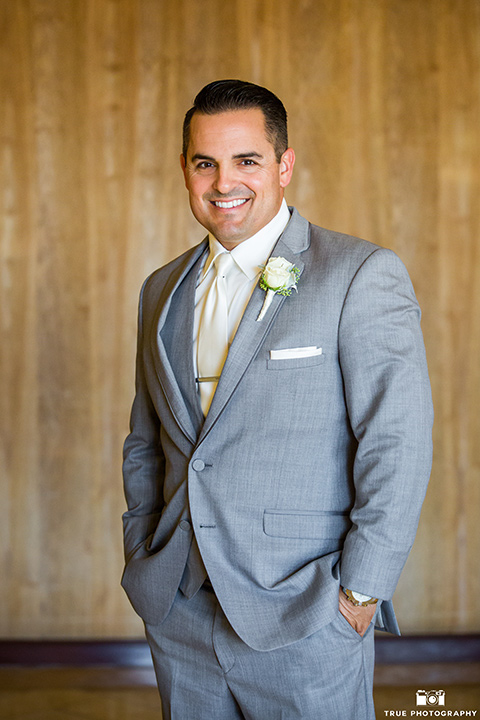 skybox-venue-wedding-groom-alone-groom-in-light-grey-suit-with-ivory-tie-groomsmen-in-dark-grey-sutis