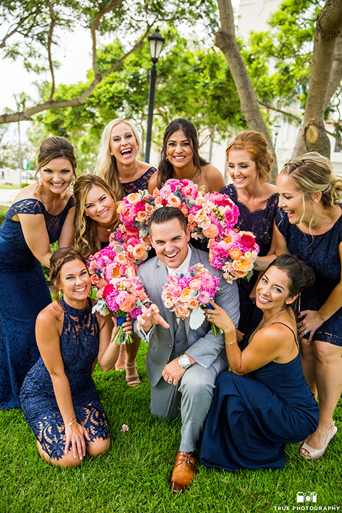 skybox-venue-wedding-groom-with-bridesmaids-groom-in-light-grey-suit-with-ivory-tie-groomsmen-in-dark-grey-sutis