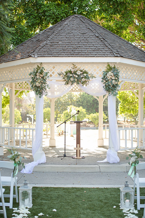 Orange county outdoor summer wedding at the heritage museum ceremony set up with white gazebo and white chiffon decor and greenery florals wedding photo idea for ceremony set up