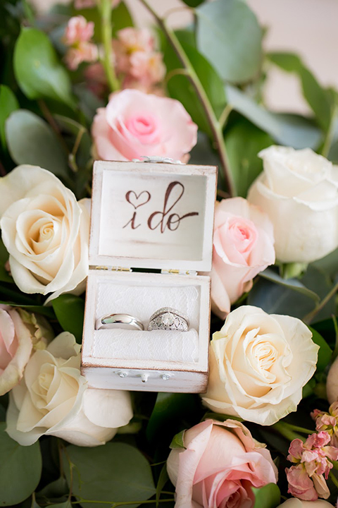 Orange county outdoor summer wedding at the heritage museum white and blush pink flowers background for wedding rings in white box with black calligraphy writing that says i do wedding photo idea for rings