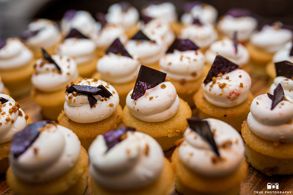 San diego outdoor wedding at leo carillo ranch reception table set up with dessert table and smores cupcakes with flower decor wedding photo idea for dessert table