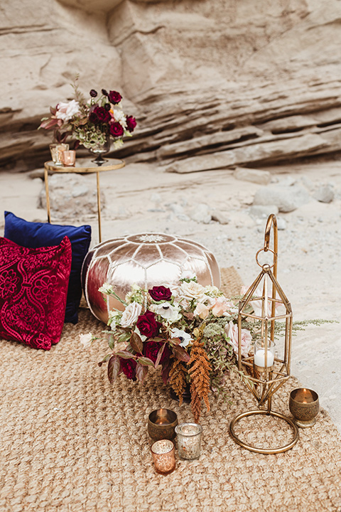 Anza-Borrego-styled-shoot-ground-decor-pillows-and-gold-candle-holders