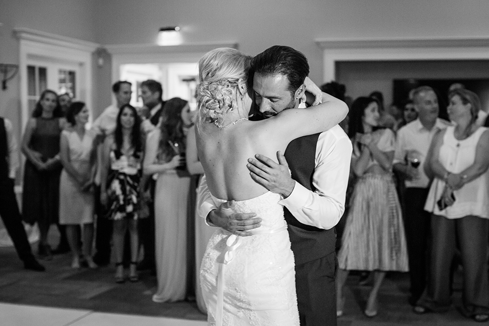 Orange county outdoor wedding at the oak canyon nature center bride form fitting mermaid style strapless gown with a crystal belt and sweetheart neckline with a long veil and groom slate blue notch lapel suit with a matching vest and white dress shirt with a long white tie and white floral boutonniere first dance