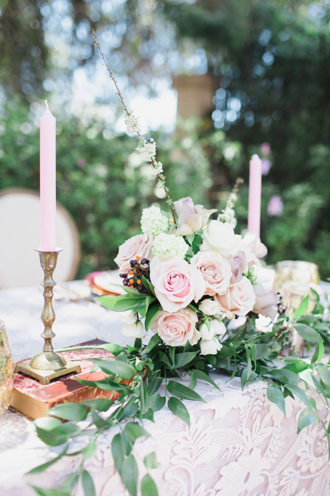 Pasadena outdoor wedding at the maxwell house table set up blush pink lace table linen with greenery floral decor and white vintage chairs with candles and flower centerpieces
