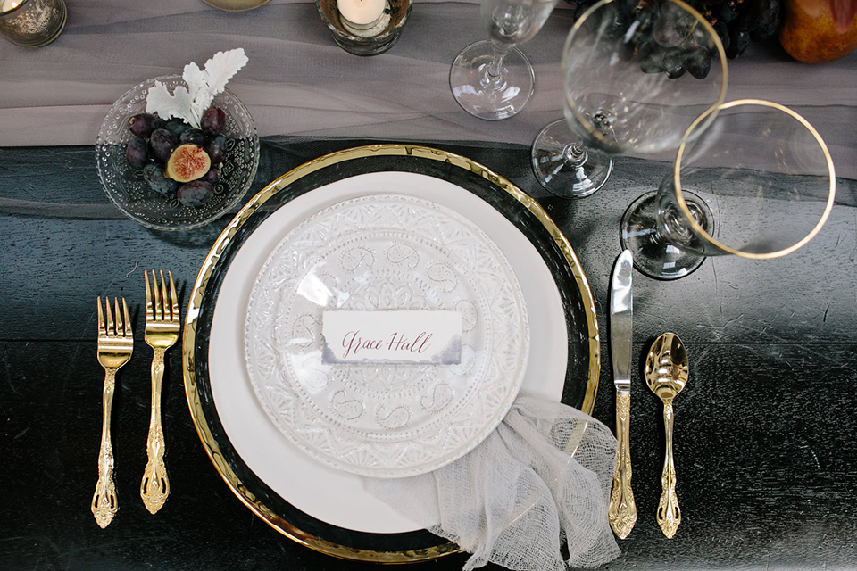 Southern-california-wedding-at-the-ebell-of-long-beach-table-set-up-with-place-setting-white-tableware-gold-silverware-clear-crystal-glasses