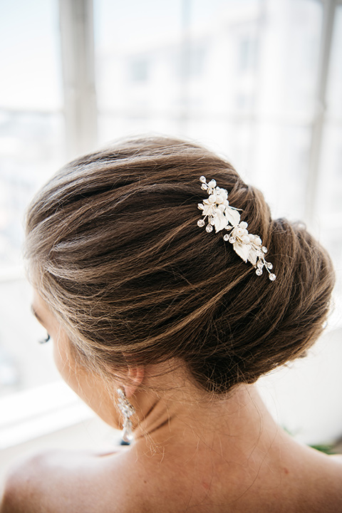 FD-Studios-bridal-gown-from-behind-bride-wearing-a-flowing-strapless-gown-with-a-lace-bodice-hair-up-with-a-crystal-hair-pin