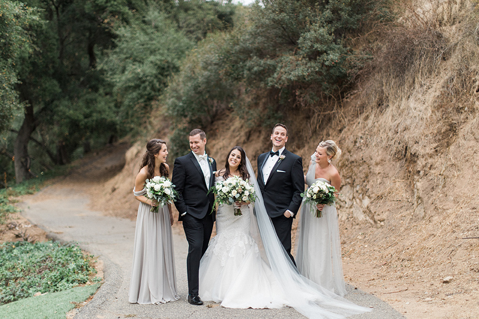 los-willows-wedding-bridal-party-bride-in-a-tulle-ballgown-with-sleeves-groom-in-a-traditional-black-tuxedo-with-black-bow-tie-and-tuxed-shoes