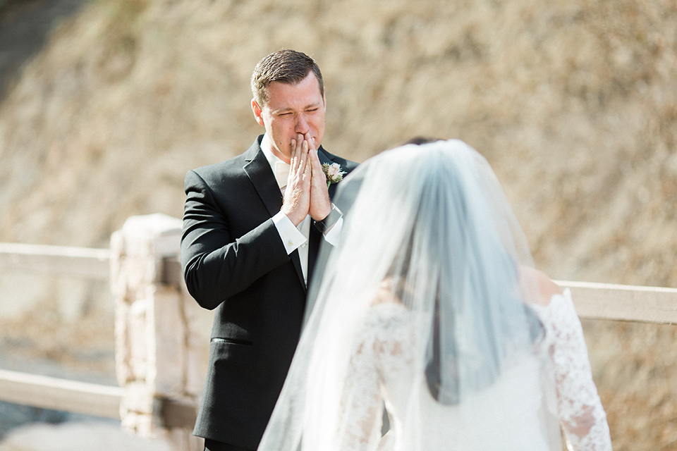 los-willows-wedding-first-look-bride-in-a-tulle-ballgown-with-sleeves-groom-in-a-traditional-black-tuxedo-with-black-bow-tie-and-tuxed-shoes