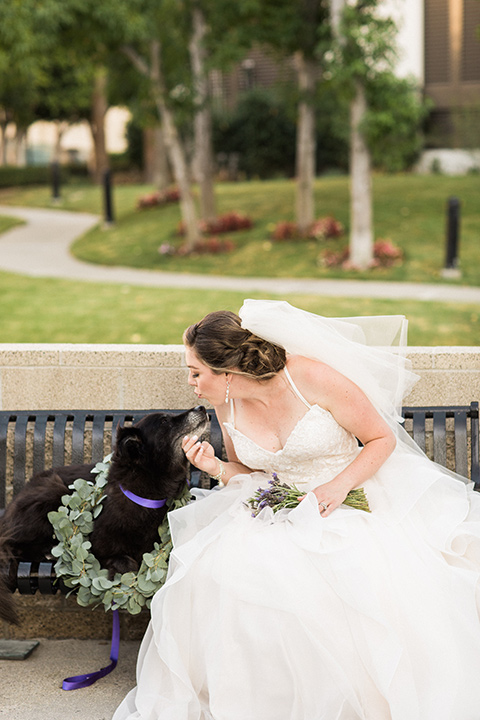 Avenue-of-the-arts-wedding-bride-with-dog-bride-in-tulle-ball-gown-with-beaded-bodice-and-beaded-headband-groom-inblack-tuxedo-with-a-silver-vest-and-silver-bowtie