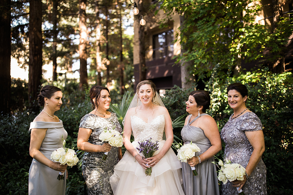 Avenue-of-the-arts-wedding-bridesmaids-bride-in-tulle-ball-gown-with-beaded-bodice-and-beaded-headband-groom-inblack-tuxedo-with-a-silver-vest-and-silver-bowtie