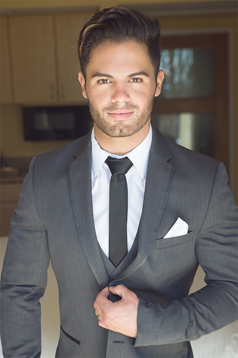 Groom-in-charcoal-tuxedo-and-a-long-black-tie