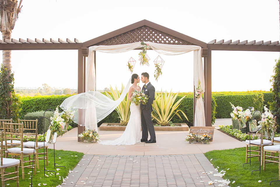  Grand-Pacific-Palisades-Groom-in-charcoal-tuxedo-with-a-long-black-tie-bride-in-a-lace-dress-with-straps 