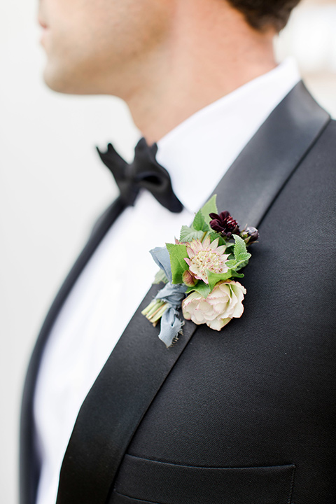 hammersky-editorial-shoot-close-up-on-groom-groom-in-a-black-shawl-lapel-tuxedo-with-black-bow