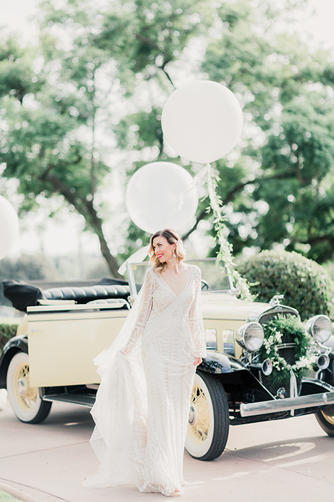 MUCKENTHALER-SHOOT-bride-and-groom-with-balloons-bride-in-fitted-satin-long-sleeve-gown