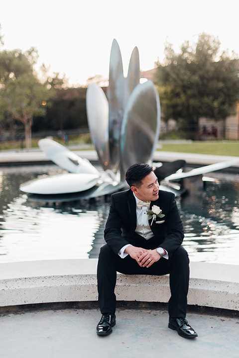 occidental-college-wedding-groom-by-fountain