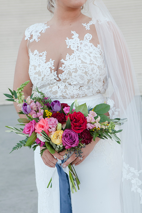 parq-west-shoot-bride-florals-bride-wearing-a-flowing-gown-with-an-illusion-lace-bodice-and-cap-sleeves