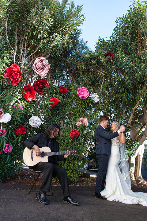 parq-west-shoot-dancing-bride-wearing-a-flowing-gown-with-an-illusion-lace-bodice-and-cap-sleeves-groom-in-a-charcoal-tuxedo-with-a-black-satin-shawl-lapel