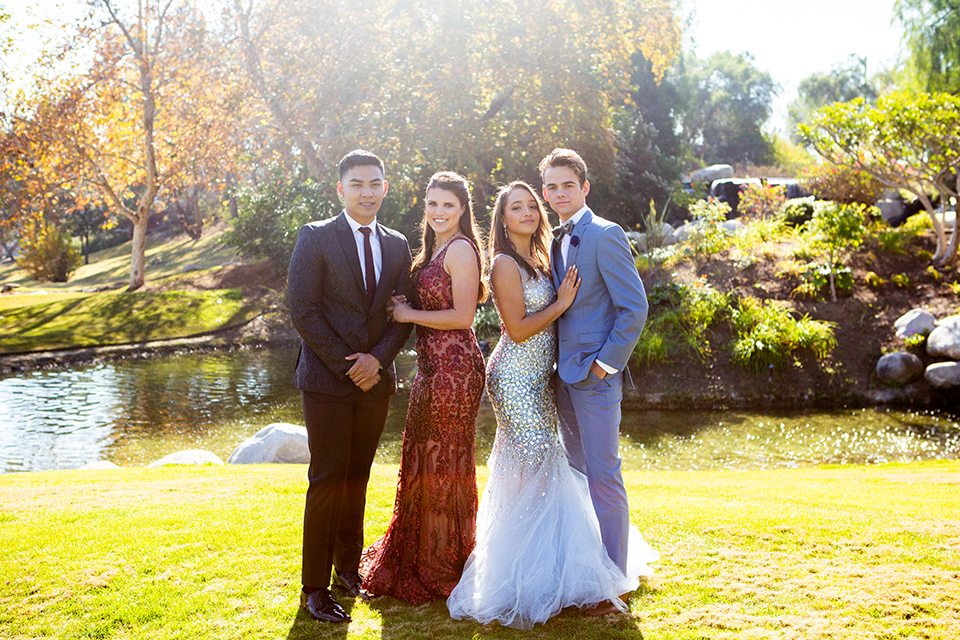 girls-in-burgundy-and-blue-dresses-boys-in-a-chacoal-paisley-coat-and-a-light-blue-suit