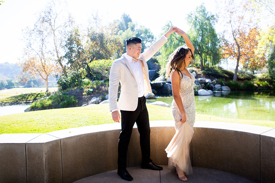 champagne-dress-with-ivory-coat-look-with-black-pants-and-black-bow-tie