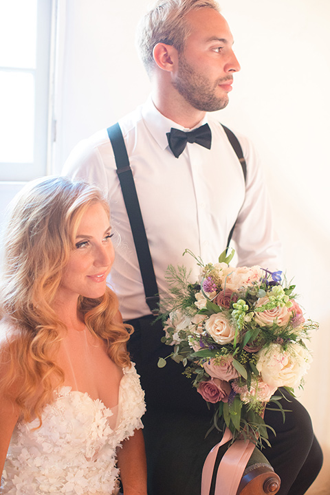 rockwood-shoot-bride-and-groom-in-chair-looking-away-groom-with-no-jacket