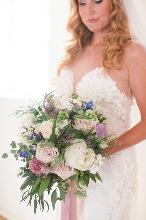 rockwood-shoot-bride-holding-flowers-rockwood-shoot-bride-full-length-in-dress-looing-down