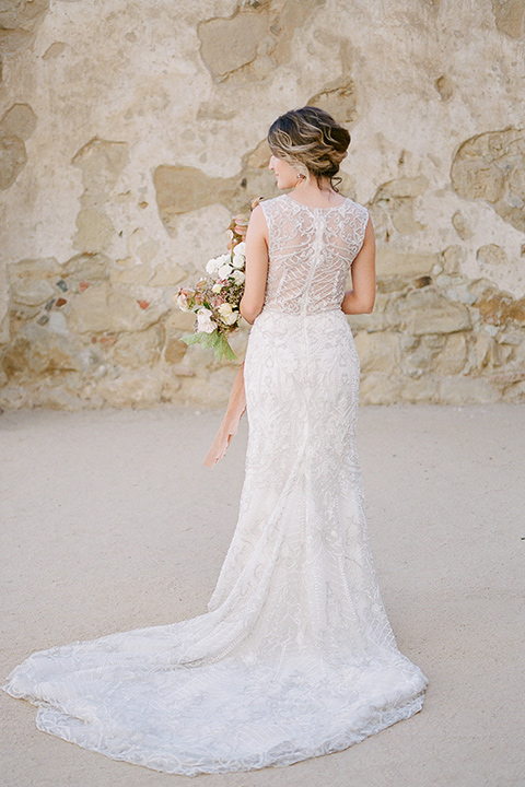 san-juan-capastrano-wedding-bride-ack-turned-bride-in-a-white-fitted-silk-dress-with-cap-sleeves-and-an-illusion-neckline-and-back