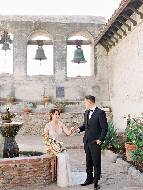 san-juan-capastrano-wedding-bride-sitting-groom-standing