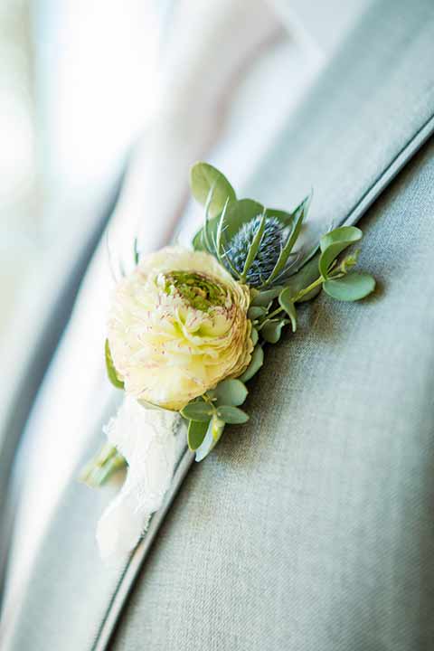 seapoint-bridal-shoot-groom-floral-groom-in-a-light-grey-suit-with-a-white-long-tie