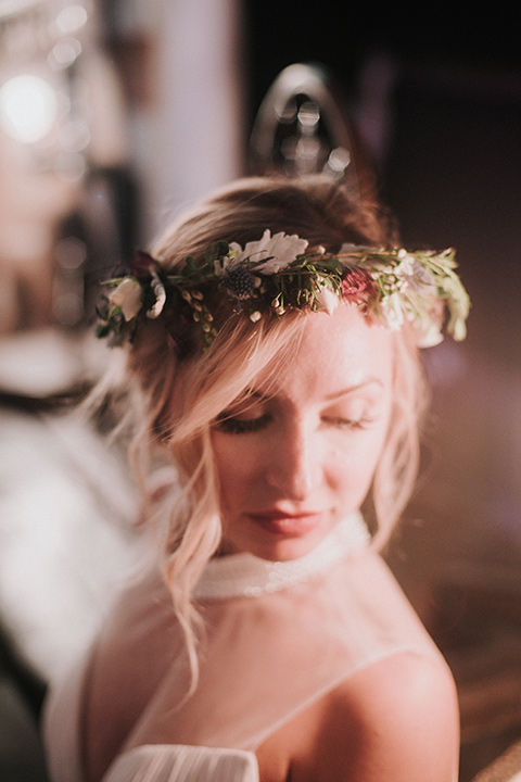 Voila-studios-bridal-crown-bride-in-a-flowing-gown-with-a-natural-waistline-and-an-illusion-neckline-with-a-floral-crown