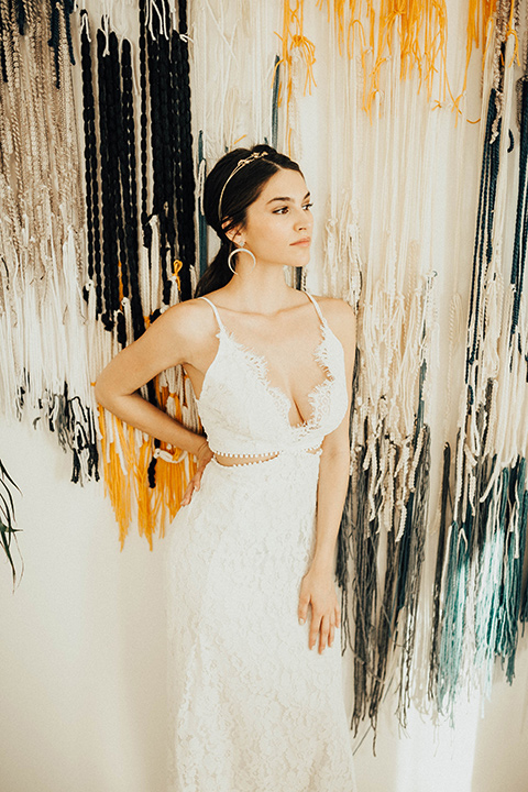 The-Ruby-Street-photoshoot-bride-looking-to-the-side-bride-in-a-lace-dress-with-a-deep-v-neckline