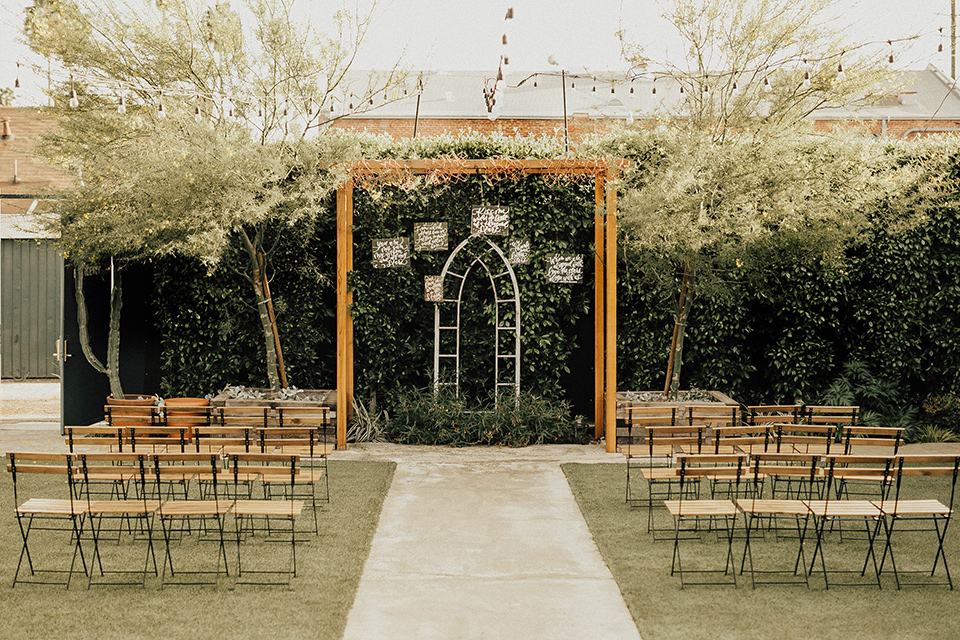 The-Ruby-Street-photoshoot-ceremony-space-with-light-wood-chairs-and-archway