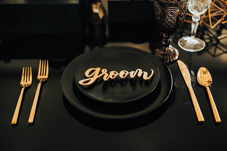 The-Ruby-Street-photoshoot-table-scape-with-black-linens-and-black-plates-and-gold-accents