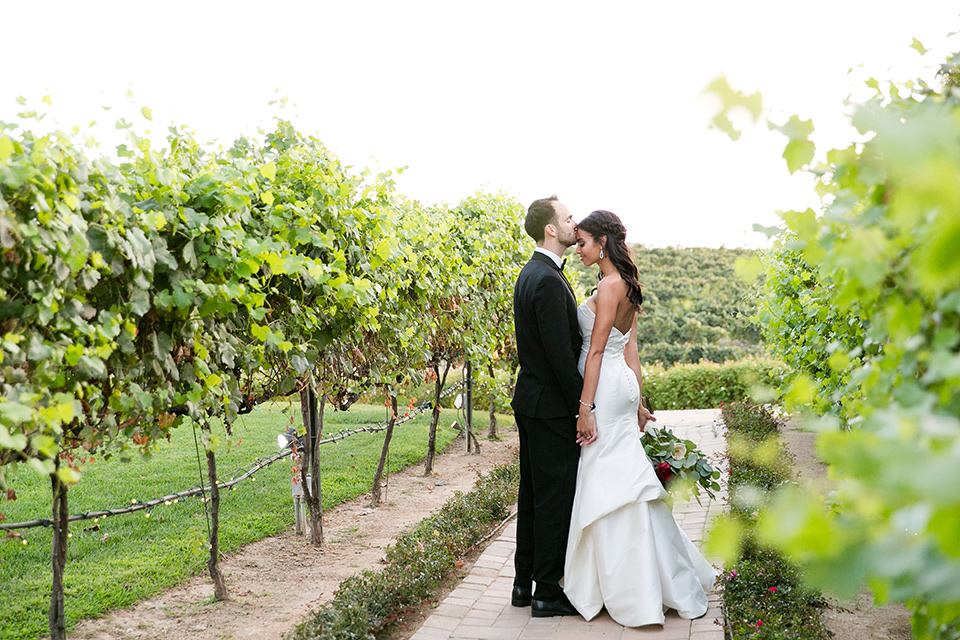 Villa-de-Amore-bride-and-groom-by-ivy-bride-in-a-fitted-gown-groom-in-a-black-tuxedo