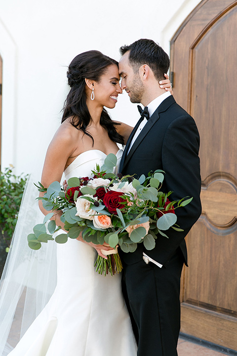 Villa-de-Amore-bride-and-groom-touching-heads-bride-and-groom-by-ivy-bride-in-a-fitted-gown-groom-in-a-black-tuxedo