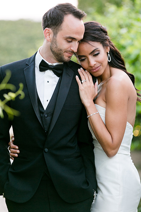 Villa-de-Amore-close-up-of-bride-and-groom-bride-and-groom-by-ivy-bride-in-a-fitted-gown-groom-in-a-black-tuxedo