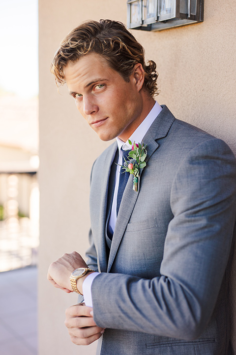 aliso Viejo wedding design with the groom in a grey suit with a navy neck tie